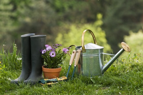 Landscapers Chiswick team carrying out safe outdoor clearance with protective equipment